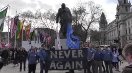 Protesters gather outside parliament to demonstrate against Syria bombings