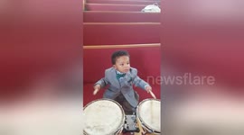 Watch this 1-year-old playing the drums like a pro