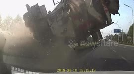 Dash-cam captures incredible cement mixer crash in China