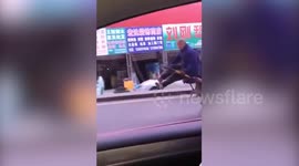 Chinese man uses modified handcart for smoother ride