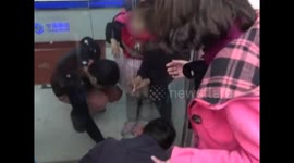Girl gets fingers stuck in glass doors of bank