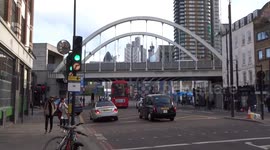 Railway Bridge over Shoreditch High Street reveals The City of London skyline
