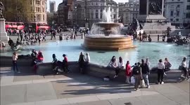 Londoners enjoy the sun in Trafalgar Square as mini heatwave hits UK