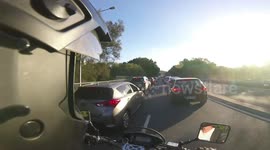 Idiot driver doesn't understand lane splitting is legal in QLD.