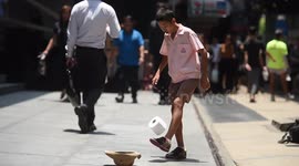 Thai schoolboy does keepie uppies with toilet roll like his hero Neymar