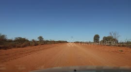 Driving Through The Outback On Dirt Red Roads, Western Australia