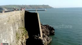 Video shows reckless youngsters tombstoning from notorious dead man's cove