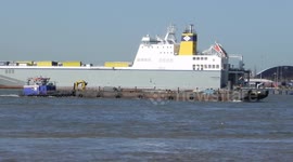 Ships on the river Thames heading under the Dartford bridge