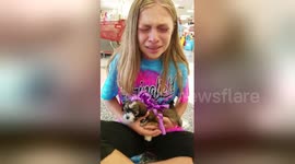 Adorable moment a girl gets surprise gift of a puppy