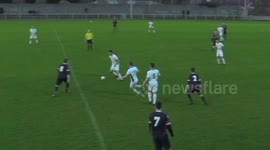 Amateur soccer player nutmegs opponent