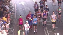 Spider man at London Marathon greets people, 2018