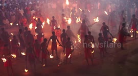Men set each other alight to appease goddess Durga
