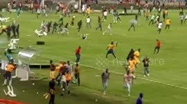 Shocking moment football fans riot on pitch after semi-final loss