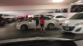 Passerby intervenes as driver's attempt at reversing into space leaves motorists speechless