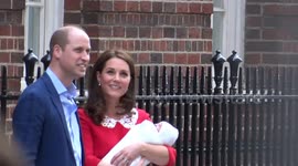 Prince William and Kate Middleton introduce baby to well-wishers outside hospital