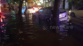 Rain floods street in Athens