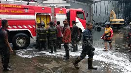 firefighters cleaned up the remaining oil after the fire extinguished