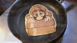 NO CAPTIONS: Chef flips pancakes into portraits of pets and pop stars