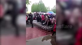 Parents surge over primary school gate as they rush for entrance interview