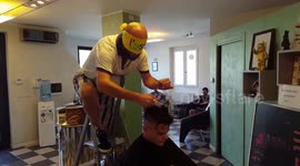 Blindfolded Italian barber performs all sorts of extreme haircuts