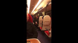 Drunk man singing loudly on train