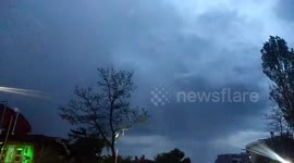 Bird flying away from lightning in 120 fps slow motion