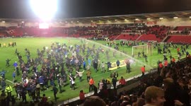 Blackburn fans invade pitch at Doncaster after win clinches promotion