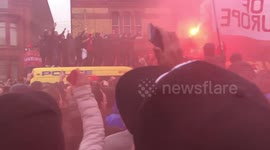Liverpool fans mount police van ahead of Champions League match