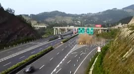 Car changing lanes crashes into embankment on motorway