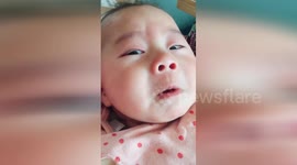 Baby pretends to cry to get parents' attention