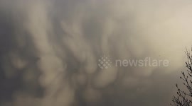 Impressive mammatus clouds form at sunset over Northern Ireland