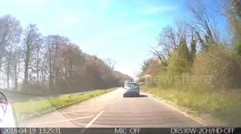 Dangerous undertake. The truck driver very nearly took the car out. Really well avoided