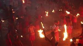 RAW: Hindu devotees take part in religious fire-throwing festival