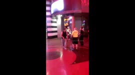 Only in Vegas...dude fight security until he gets tackled by a football team of securities!!!!