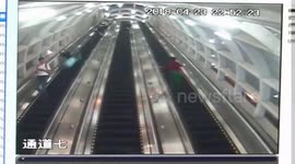 Runaway suitcase caught on video knocking down woman on escalator