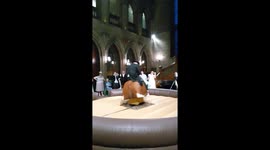 Groom rides mechanical bull
