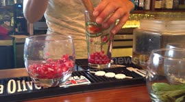 How to Make a Muddled Pomegranate Martini with Elderflower Liqueur