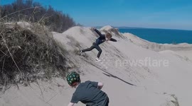 Sand dune jump fail! Child face plants after pulling full scorpion
