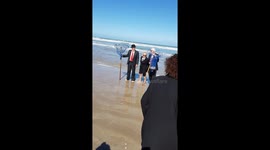 Bowler hats in the surf