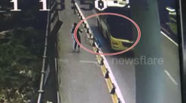 Boy narrowly escapes being run over by bus after tripping over guard rails