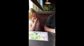 Little girl tries a fireball candy