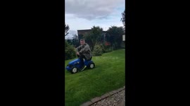 Boy drop kicks tractor