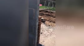 Hilarious moment builder topples concrete slabs to wake up napping mate