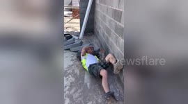 Hilarious moment builder topples concrete slabs to wake up napping mate