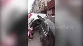 Newbie motorist drives onto top of bonnet of another car