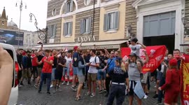 Chanting Liverpool supporters watched by Rome police