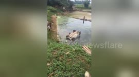Moment driver is pulled out of hatchback that plummeted into lake