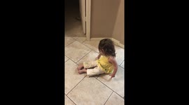 Cute toddler throws tantrum after faking falling down during game of catch