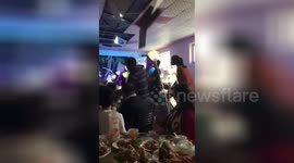 Bride's bouquet toss causes ceiling to collapse on top of guests