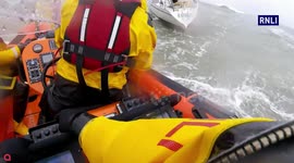 Lifeboat crew struggle to save stricken yacht
